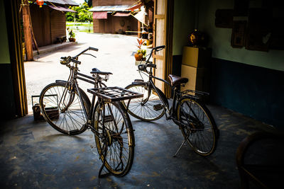 Bicycle parked on footpath outside building