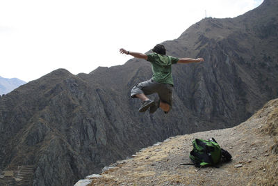 Man jumping on mountain