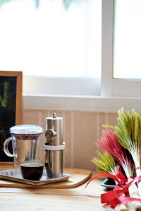 Close-up of coffee cup on table at home