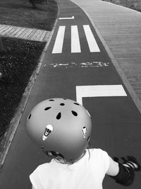 High angle view of child playing on street