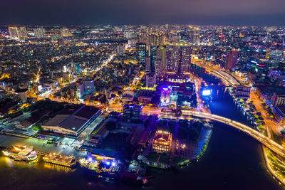 High angle view of illuminated city buildings at night
