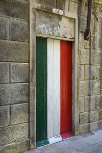 Door painted with italian flag's colors.