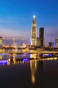 Illuminated buildings in city at night