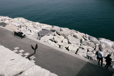 High angle view of groynes by sea