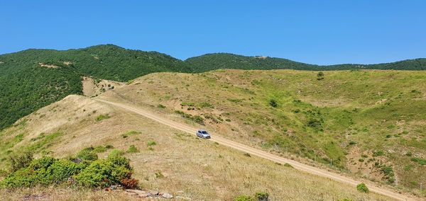 Scenic view of landscape against clear blue sky