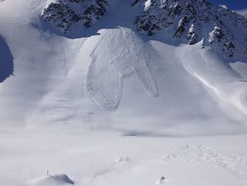 Scenic view of snow covered field and mountains