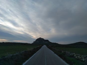 Road amidst landscape against sky