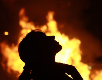 Silhouette of bonfire at night