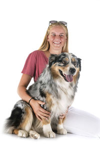 Portrait of a dog against white background