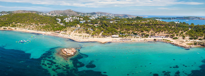 High angle view of sea and trees against sky