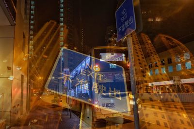 Illuminated road sign at night