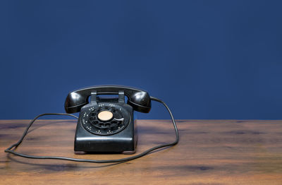 Close-up of telephone on table