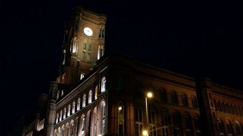 Low angle view of illuminated buildings at night