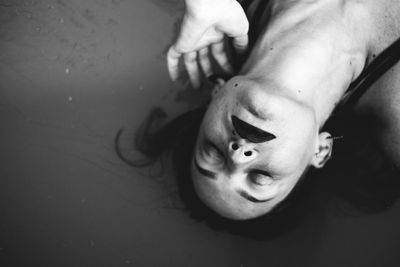 High angle view of young woman in lake