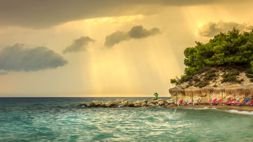 Scenic view of sea against sky at sunset