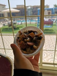 Close-up of hand holding drink