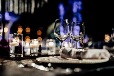 Luxury table settings for fine dining with and glassware, beautiful blurred background. 