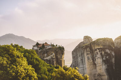 Panoramic view of trees and mountains against sky