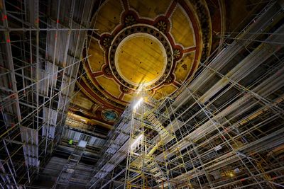 Low angle view of illuminated ceiling at night