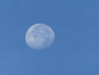 Low angle view of moon against clear sky