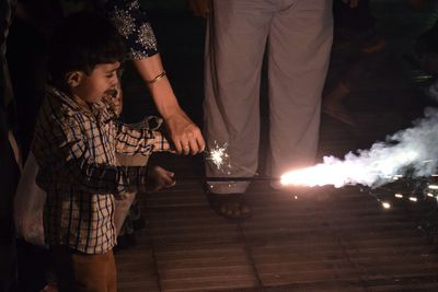 People burning sparklers