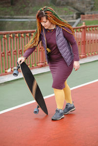 Low section of woman exercising in gym