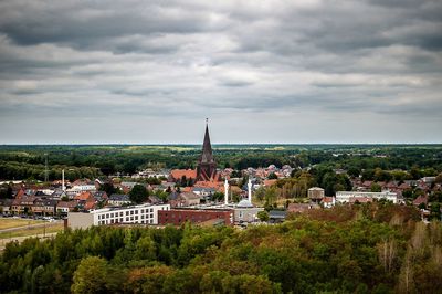 High angle view of trees and buildings against sky