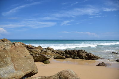 Scenic view of sea against blue sky