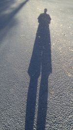 Shadow of people on road