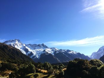 Scenic view of mountains against cloudy sky