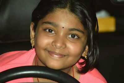 Close-up portrait of smiling girl