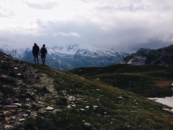 Rear view of silhouette man on mountain