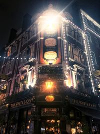 Low angle view of illuminated building at night