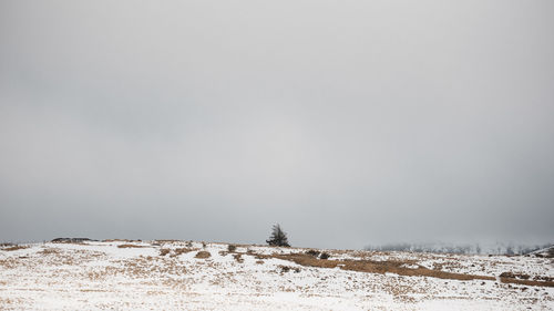 Scenic view of snow covered mountain against clear sky