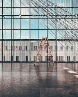 Reflection of modern building in glass on floor