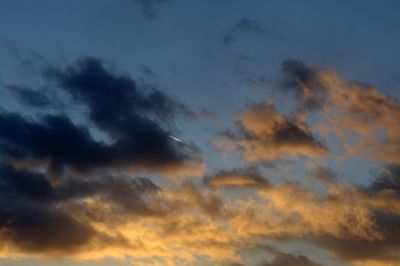 Low angle view of dramatic sky during sunset