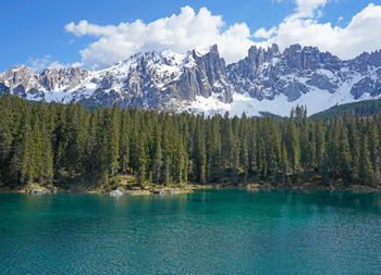 Mountain lake and forest, lake carezza in the dolomites, italy.