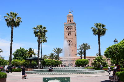 View of palm trees against blue sky