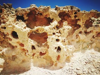 Close-up of rock formation on sunny day