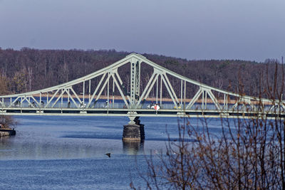 Bridge over river against sky