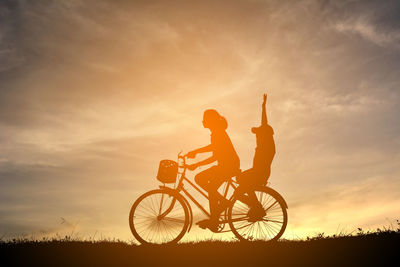 Bicycle against sky during sunset