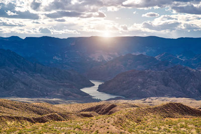 Scenic view of mountains against sky during sunset