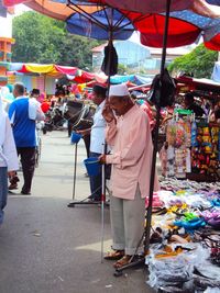People at market stall