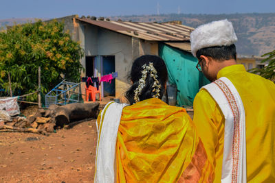 Rear view of people in traditional clothing