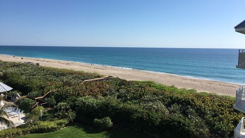 Scenic view of sea against clear blue sky