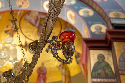 Close-up of decoration hanging on ceiling in temple