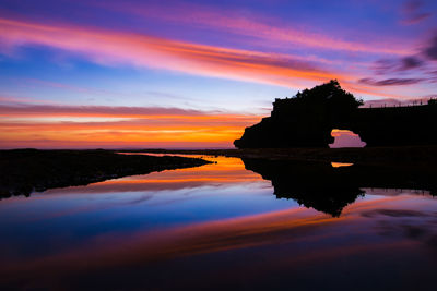 Scenic view of sea against orange sky