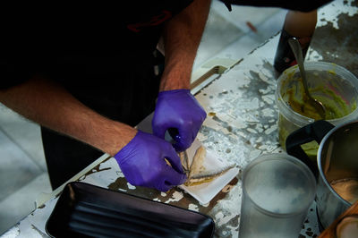 High angle view of man preparing food