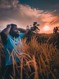 Man standing on land against sky 