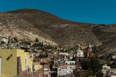 Townscape against mountain